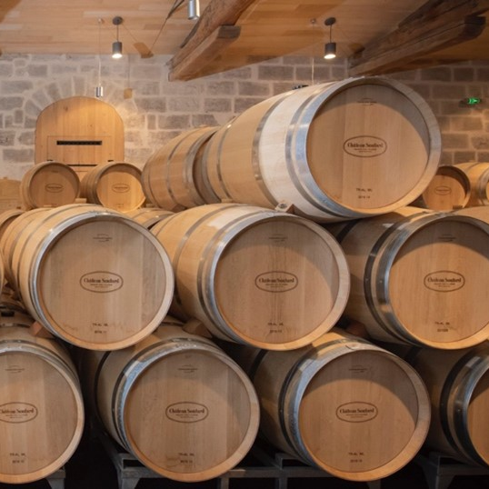 How do you maintain oak barrels until they are resold for wine?